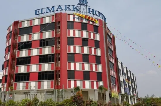 Curved red, white and black facade of Elmark Hotel, Permas Jaya